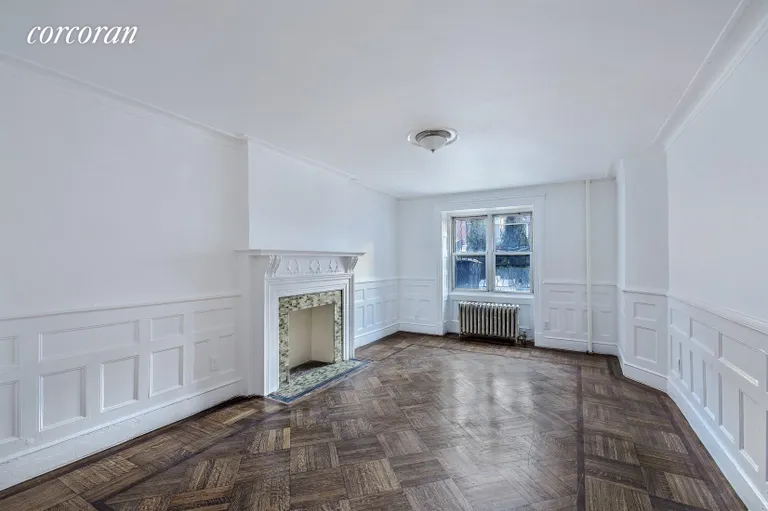 New York City Real Estate | View 911 Sterling Place | Bedroom w/ Original Parquet Floor & Fireplace | View 3