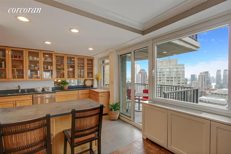 New York City Real Estate | View 10 West 66th Street, 32D | Kitchen with Breakfast Bar | View 3