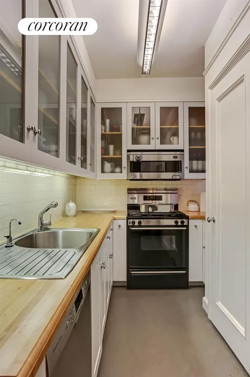 New York City Real Estate | View 114 East 90th Street, 8C | Renovated Kitchen with Washer/Dryer | View 2