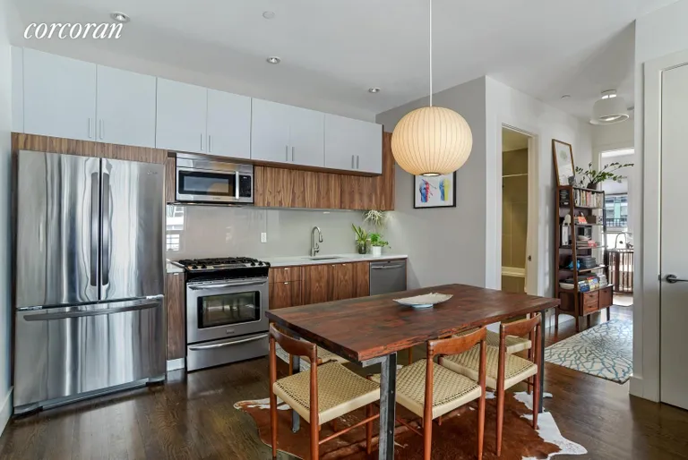 New York City Real Estate | View 5 Roebling Street, 3B | Stylish kitchen with walnut veneer cabinets | View 3
