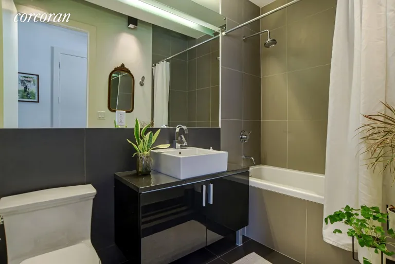 New York City Real Estate | View 5 Roebling Street, 3B | Sleek bathroom with deep soaking tub | View 6