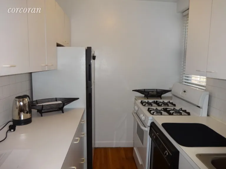 New York City Real Estate | View 2102 Holland Avenue, 1A | Eat In Kitchen, Dishwasher & window | View 4