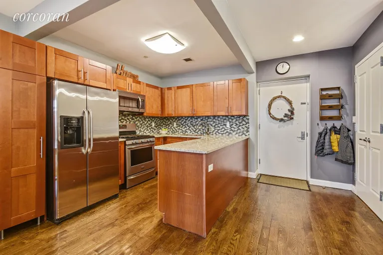 New York City Real Estate | View 1138 Ocean Avenue, 1A | Large custom kitchen with wrap around island. | View 2