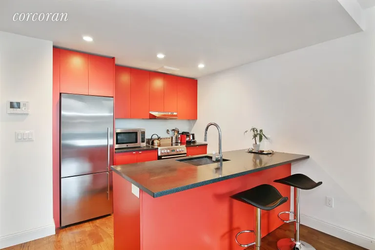 New York City Real Estate | View 954 Bergen Street, 4C | Kitchen with Island and Bar Stool Seating  | View 2