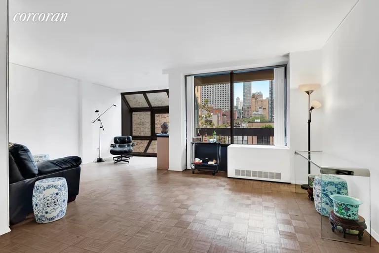 New York City Real Estate | View 245 East 50th Street, 7B | Oversized Living Room with Natural Light and Views | View 2