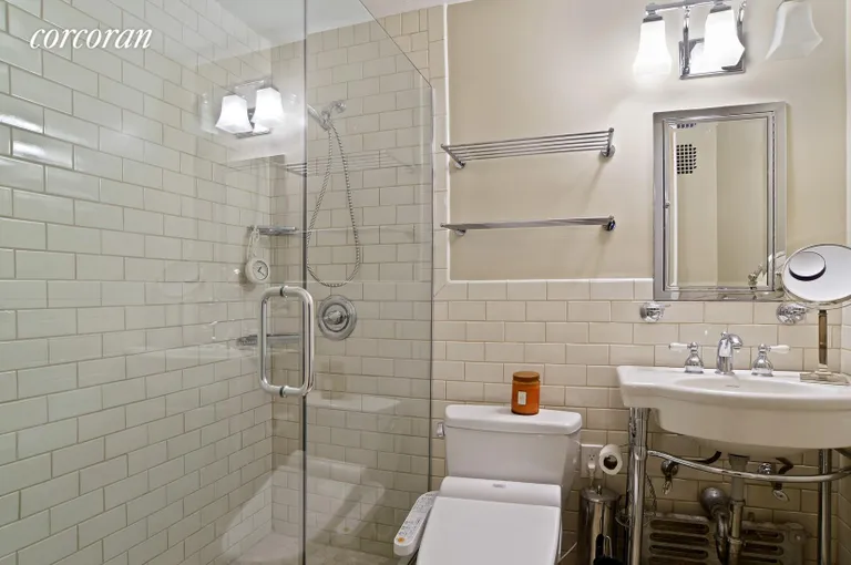 New York City Real Estate | View 220 Madison Avenue, 9C | Subway Tiling & Mirrored Vanity for Extra Storage | View 5