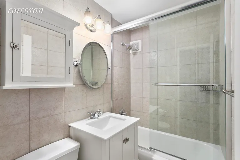 New York City Real Estate | View 239 East 79th Street, 13H | Renovated bathroom and tub/shower | View 4