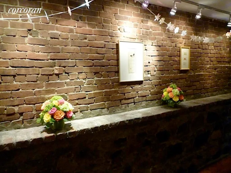 New York City Real Estate | View 310 Warren Street, 1 | Entry Hall Way with Exposed Brick | View 7