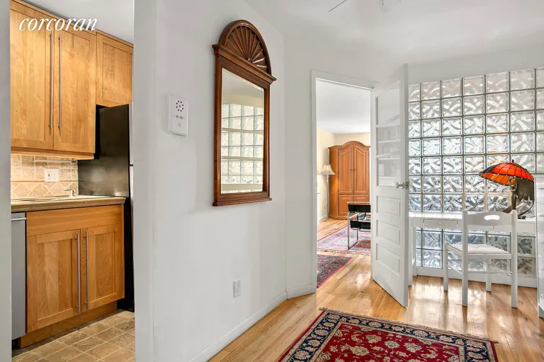 New York City Real Estate | View 67 East 11th Street, 612 | Sleeping area with Murphy Bed and glass wall | View 2