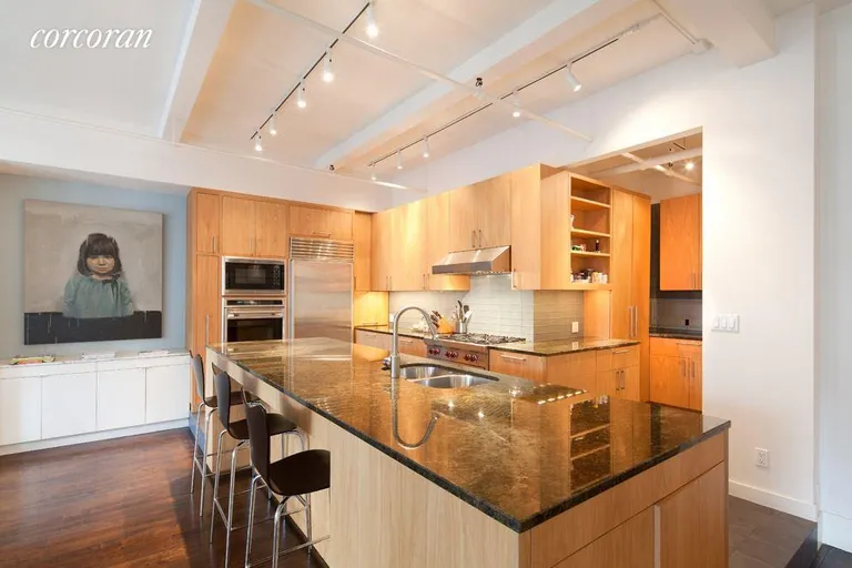 New York City Real Estate | View 30 West 15th Street, 3S | Large, modern chef's kitchen overlooks dining area | View 4