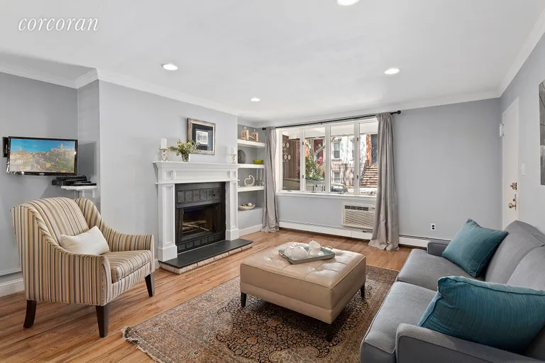 New York City Real Estate | View 164 Huntington Street, A | Living room with WBFP | View 2
