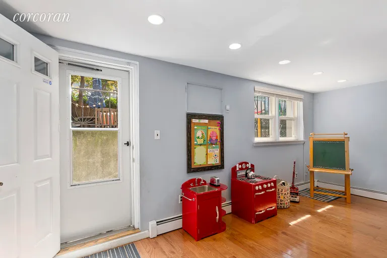 New York City Real Estate | View 164 Huntington Street, A | Playroom Leading to Garden | View 9