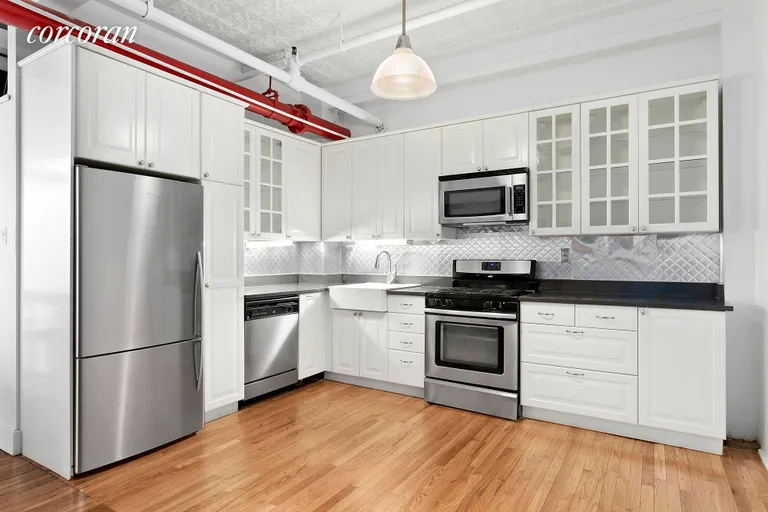New York City Real Estate | View 107 West 25th Street, 6A | Stainless steel appliances incl. a dishwasher | View 3