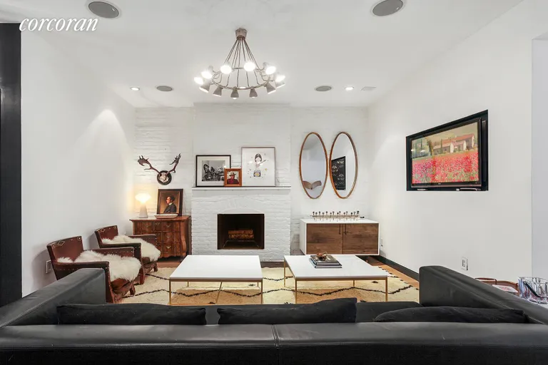 New York City Real Estate | View 79 Saint Marks Place | Cozy den with fireplace | View 4
