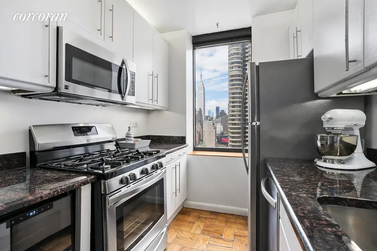 New York City Real Estate | View 415 East 37th Street, 22N | Windowed Kitchen with ESB Views | View 3