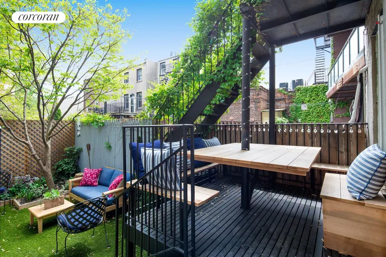 New York City Real Estate | View 233 Court Street, 1 | Deck w/built-in dining overlooking tranquil garden | View 3