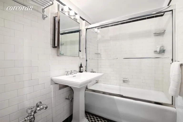 New York City Real Estate | View 410 West 24th Street, 11K | Black and white London Terrace bath | View 4