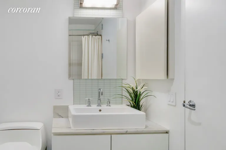New York City Real Estate | View 48-21 5th Street, 4I | Modern vanity & sleek finishes | View 4