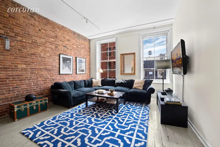 New York City Real Estate | View 148 Mercer Street, 3 FL | Living room with large windows and exposed brick  | View 2