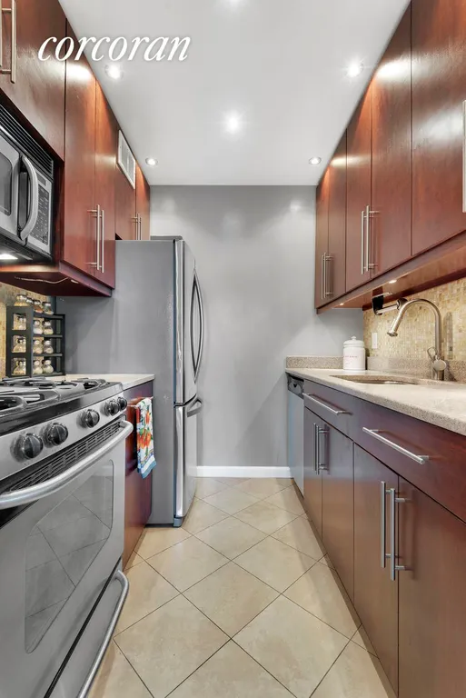 New York City Real Estate | View 250 East 40th Street, 29B | Renovated kitchen with Stainless Steel appliances | View 4