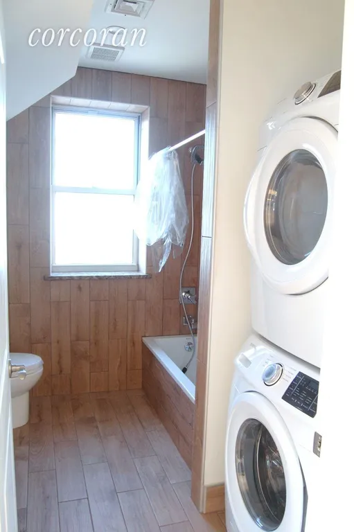 New York City Real Estate | View 93 Norwood Avenue, 3rd Floor | Bathroom #1 with Laundry | View 5