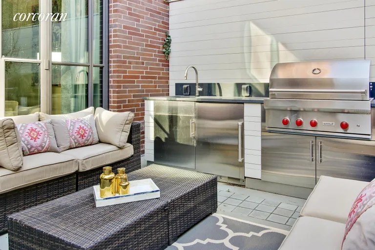 New York City Real Estate | View 215 Sullivan Street, THC | Backyard with Summer Kitchen | View 5