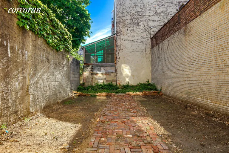 New York City Real Estate | View 397 Rogers Avenue | Spacious Backyard Off the Storefront | View 9
