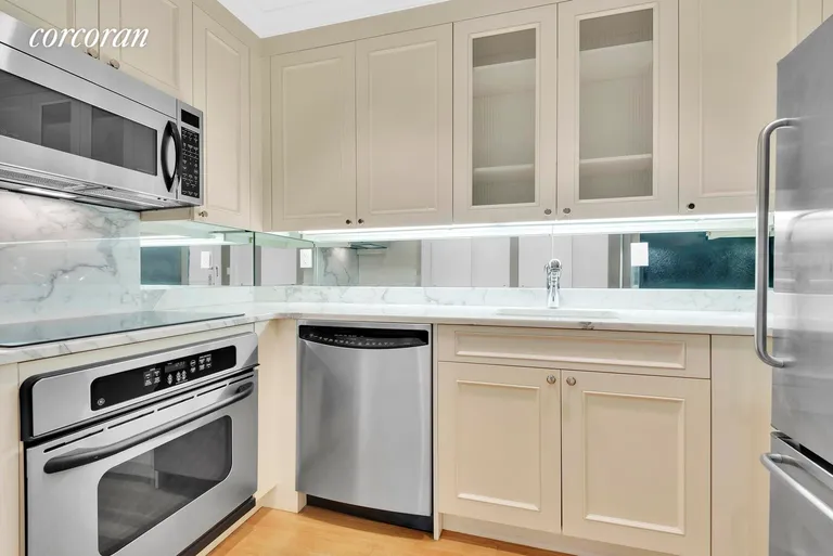 New York City Real Estate | View 502 Park Avenue, 12F | Stunning Kitchen with Stainless Steel Appliances | View 3