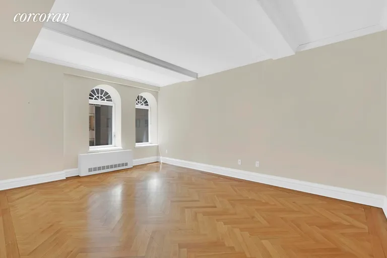New York City Real Estate | View 502 Park Avenue, 12F | Spacious Sunny Living Room with Beamed Ceilings | View 5