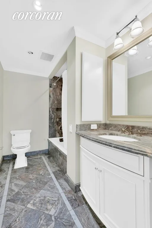New York City Real Estate | View 502 Park Avenue, 12F | Marbled En-Suite Bathroom | View 4