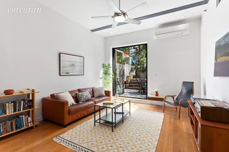 New York City Real Estate | View 46 Butler Street, LL | Living Room with High Ceilings opens to Garden  | View 2