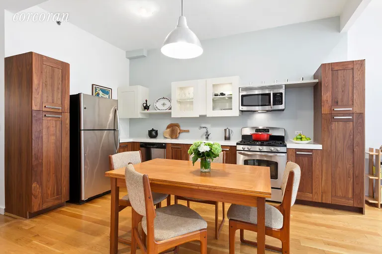 New York City Real Estate | View 46 Butler Street, LL | Kitchen Dining with Walnut Cabinets  | View 3