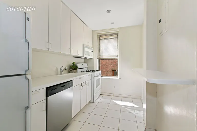 New York City Real Estate | View 222 East 82nd Street, 4C | Bright Kitchen with western exposure | View 5