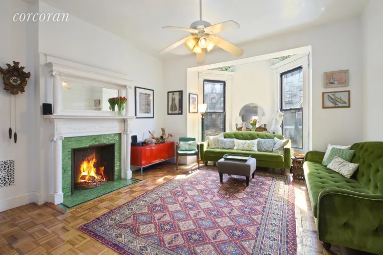 New York City Real Estate | View 582 Jefferson Avenue | Elegant living room w/fireplace and bay window | View 2