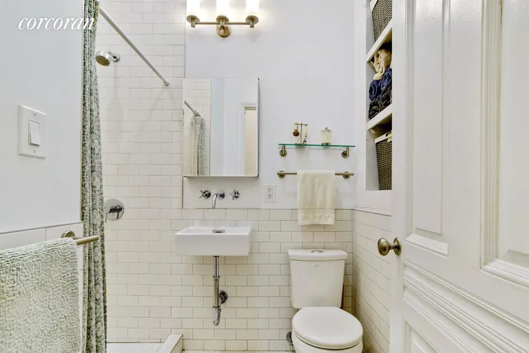 New York City Real Estate | View 134 Berkeley Place, 2 | Subway tiling, custom vanity and built-in shelving | View 7