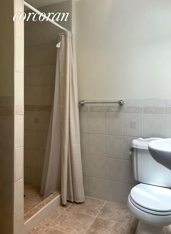 New York City Real Estate | View 371A Gates Avenue, 2 | Second bathroom with walk in shower stall | View 10