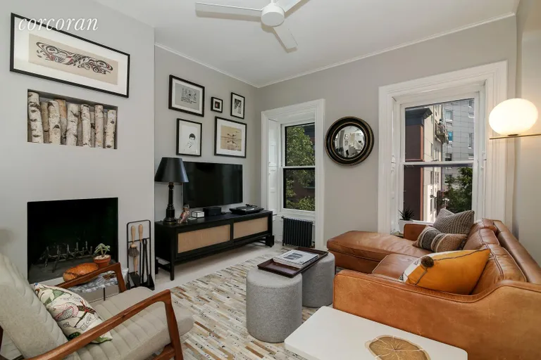 New York City Real Estate | View 144 Park Place, 6 | Living Room with Wood-burning fireplace | View 4