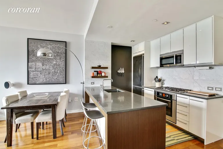 New York City Real Estate | View 58 Metropolitan Avenue, 6F | Modern Open Kitchen with Breakfast Bar | View 2