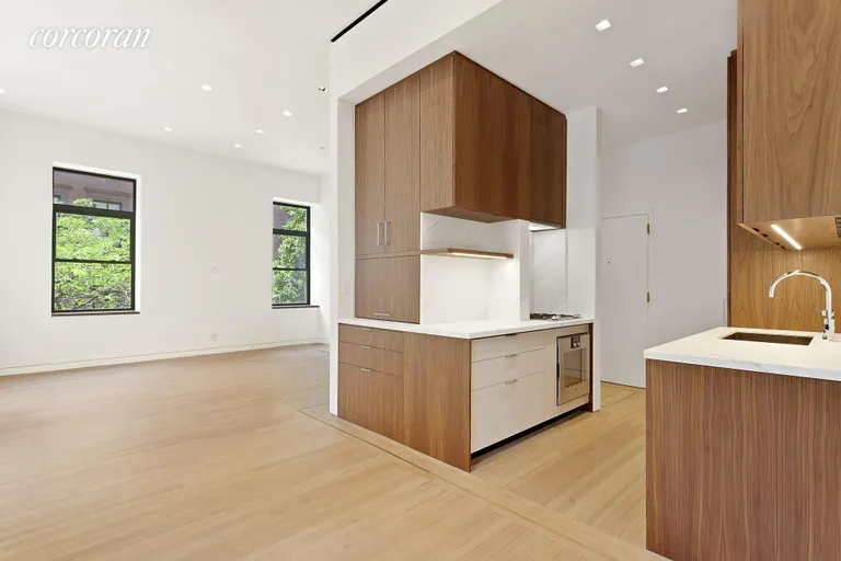 New York City Real Estate | View 7 GRAMERCY PARK WEST, 2-C | Renovated Kitchen Flows into Living and Dining  | View 3