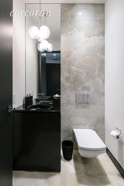 New York City Real Estate | View 157 West 57th Street, 43B | Powder Room | View 8