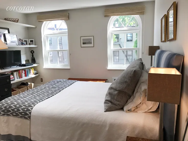 New York City Real Estate | View 6 Verandah Place | Master Bedroom with Shelves, Closets and Skylight  | View 7