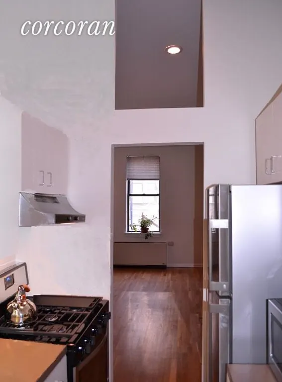 New York City Real Estate | View 121 Pacific Street, A2F | Galley Kitchen opening onto Living/Dining Area | View 3