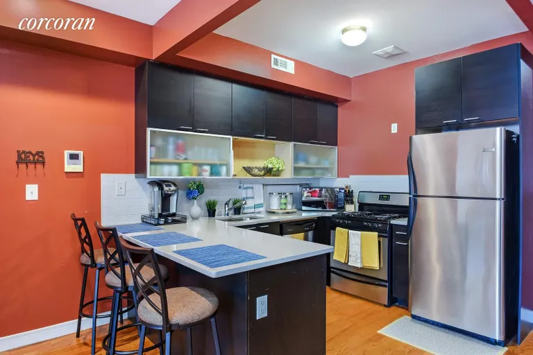 New York City Real Estate | View 1613 Bergen Street, 2 | Breakfast Bar and Stainless Steel Appliances | View 3
