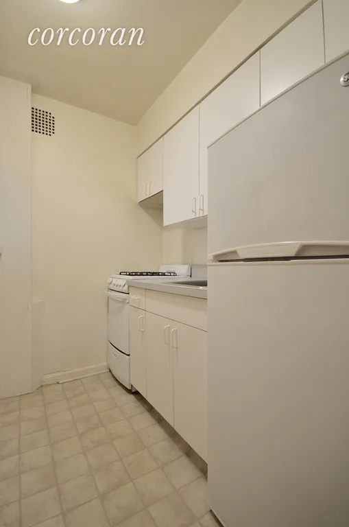 New York City Real Estate | View 222 East 75th Street, 4C | Kitchen with lots of cabinets.  | View 3