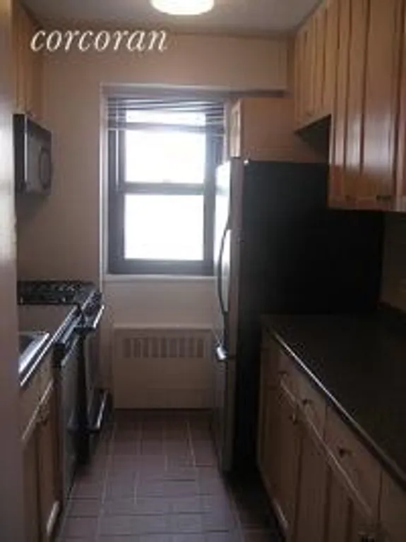 New York City Real Estate | View 345 East 80th Street, 10J | Kitchen with Window | View 3