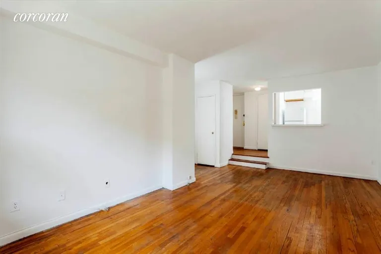 New York City Real Estate | View 131 West 85th Street, 2C | Sunken living room and pass-thru kitchen. | View 2