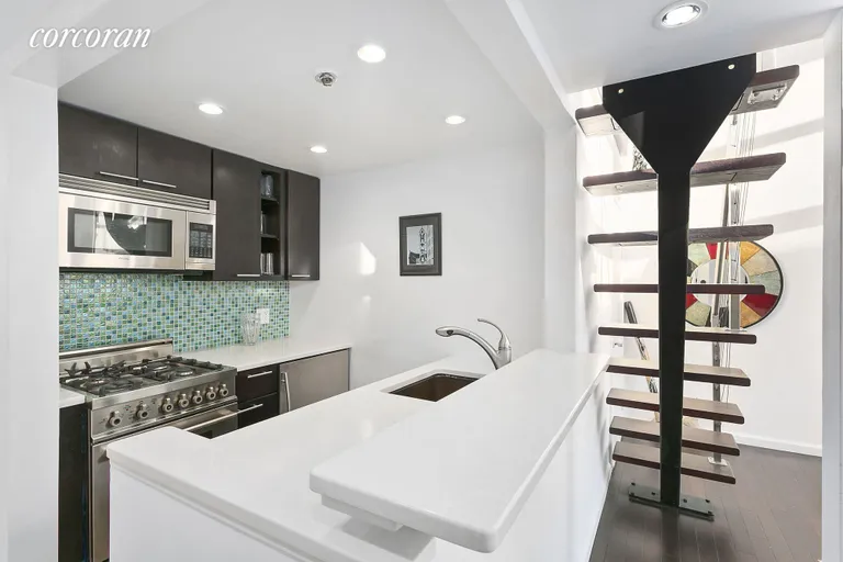 New York City Real Estate | View 67 East 11th Street, 521 | Renovated Silestone Kitchen with Bertazzoni Range | View 5