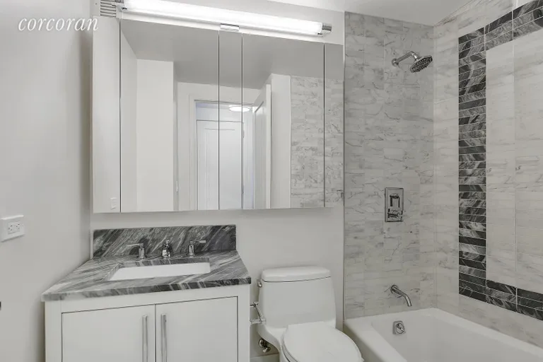 New York City Real Estate | View 200 East 94th Street, 603 | Luxurious Bathroom with Caldia marble | View 5