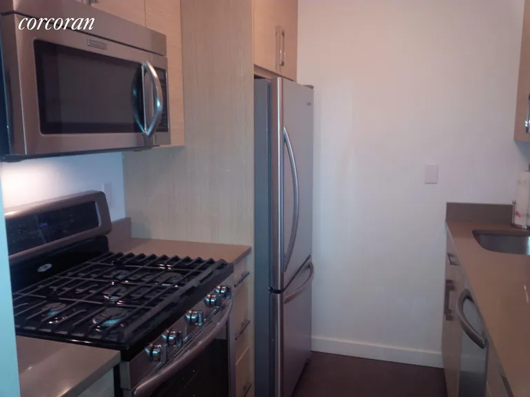 New York City Real Estate | View 171 East 84th Street, 11H | Renovated Pass-Through Kitchen | View 2