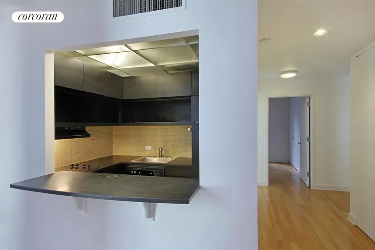 New York City Real Estate | View 56 Pine Street, 11A | Pass-through kitchen with breakfast bar | View 4